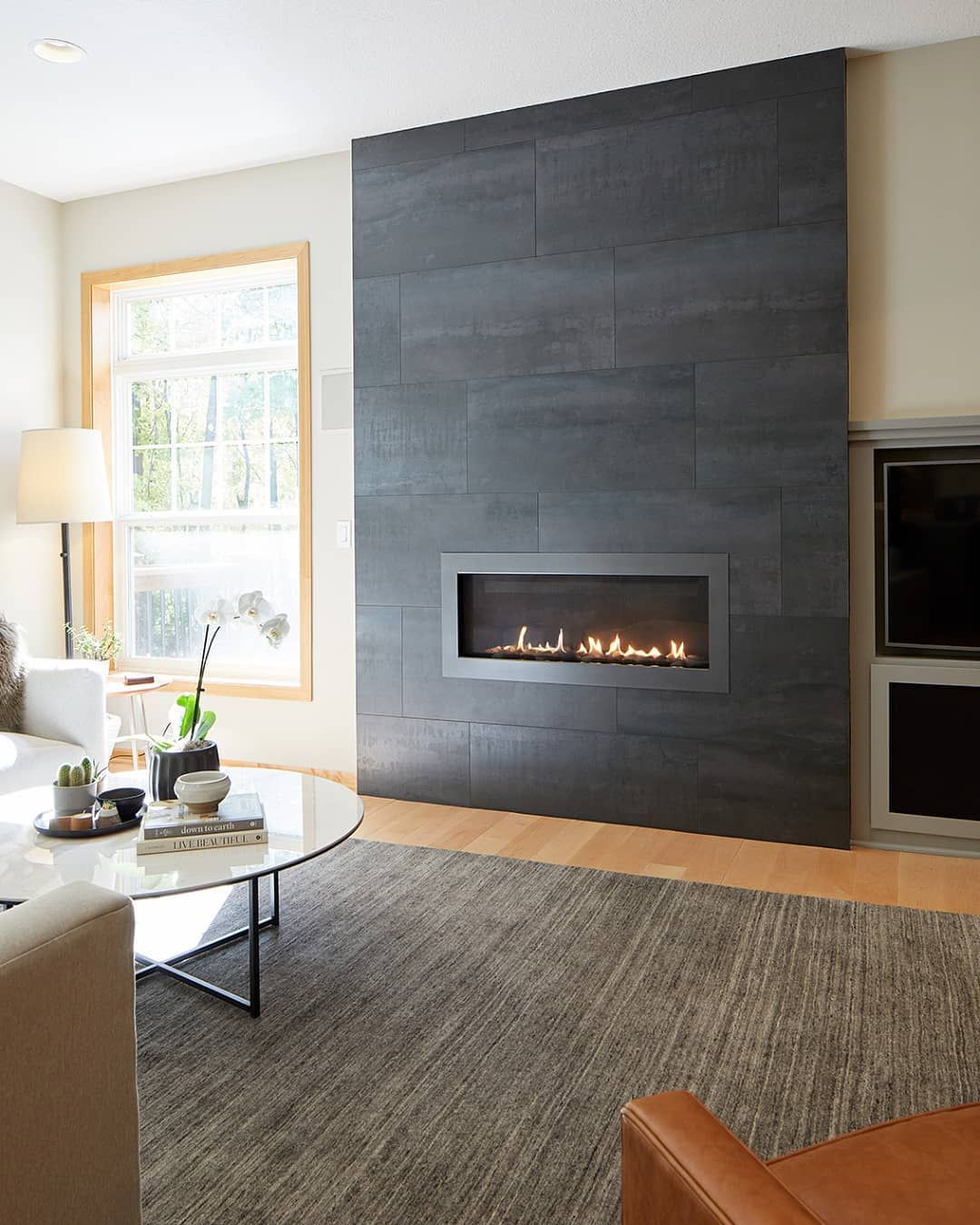 Black Marble Floor to Ceiling Fireplace