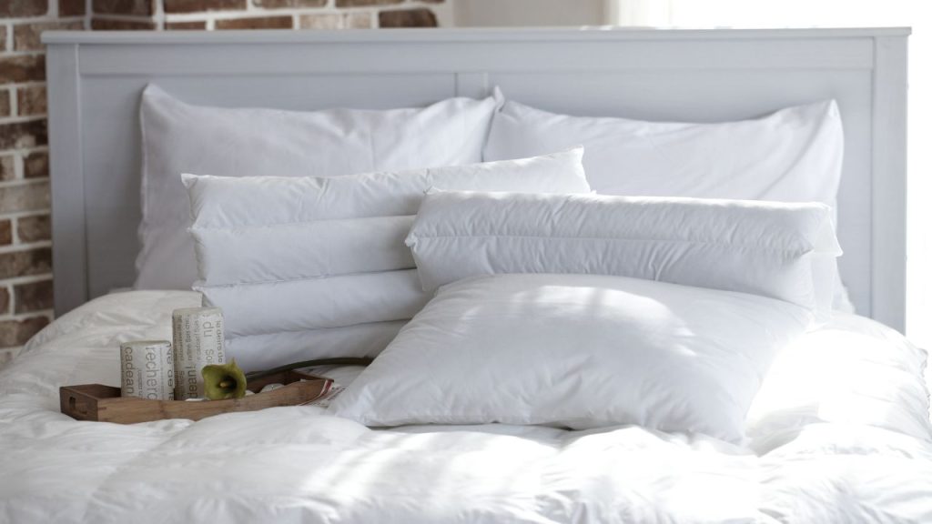 Remember your pillows when trying to prevent dust in your bedroom